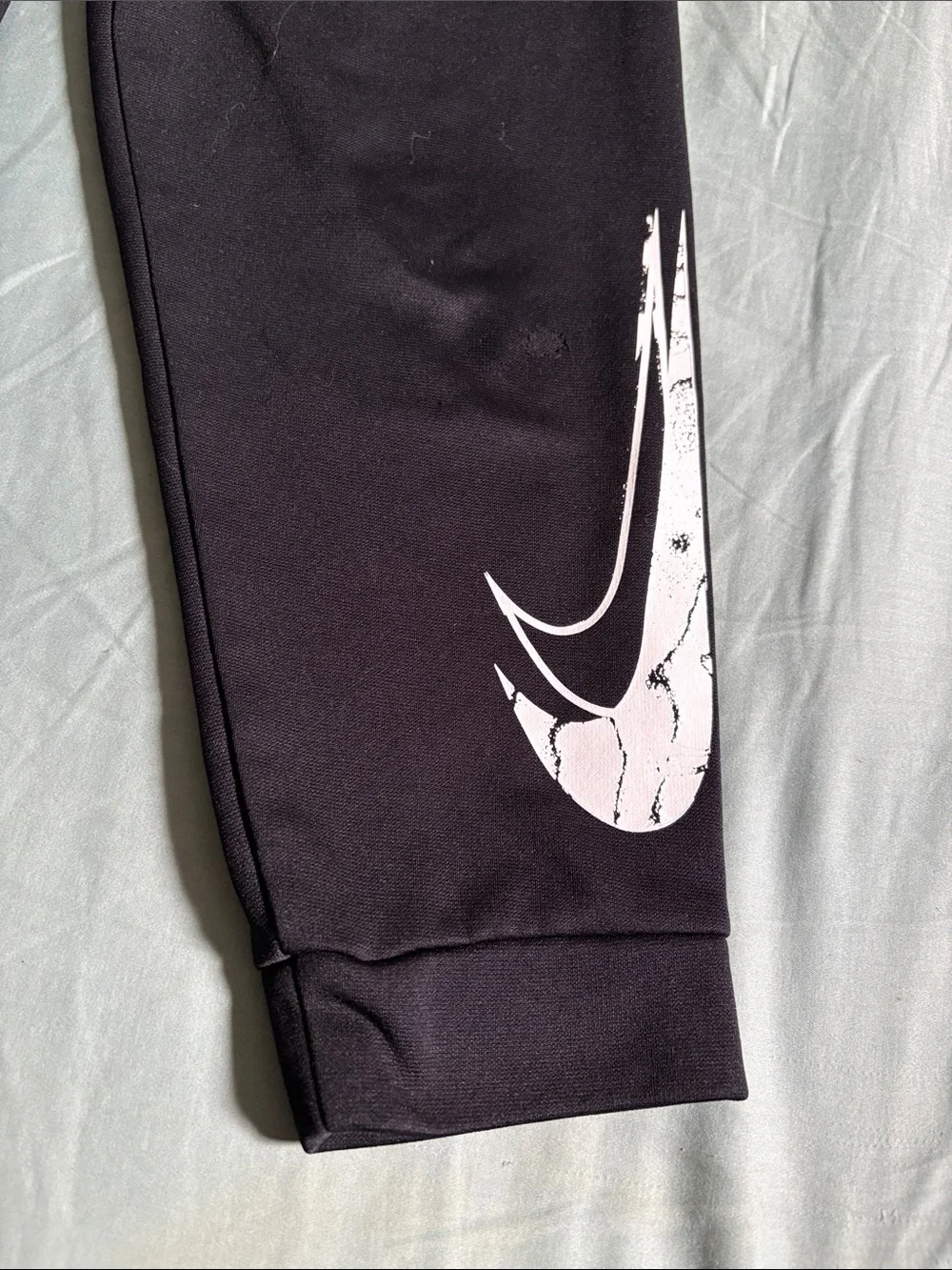 Nike Kids Black Joggers with White Swoosh Graphic